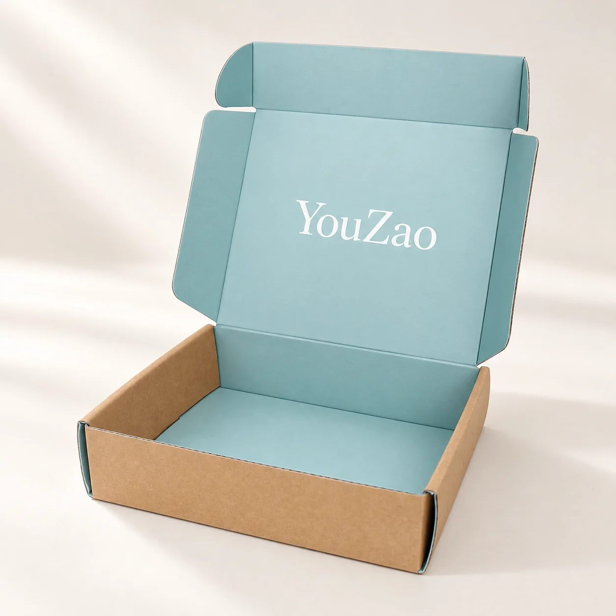 Open corrugated clothing mailer box with kraft exterior blue interior and custom logo