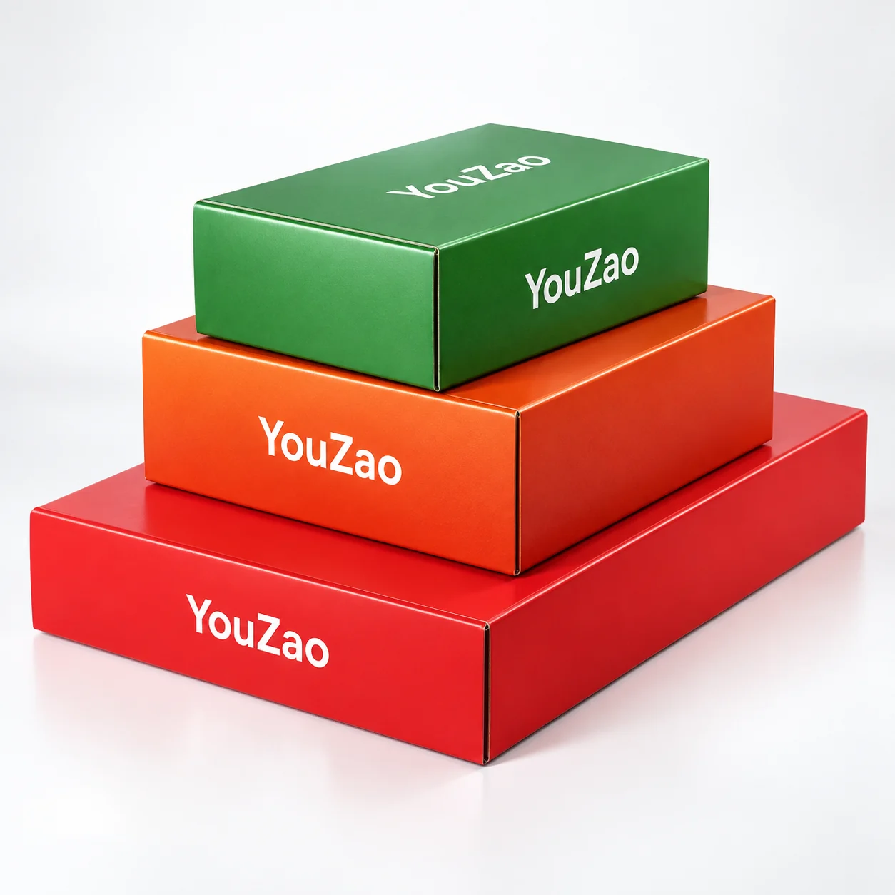Stacked green orange and red custom printed folding corrugated gift boxes