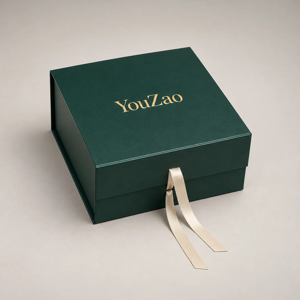 Green magnetic gift box with a front ribbon detail and gold YouZao logo