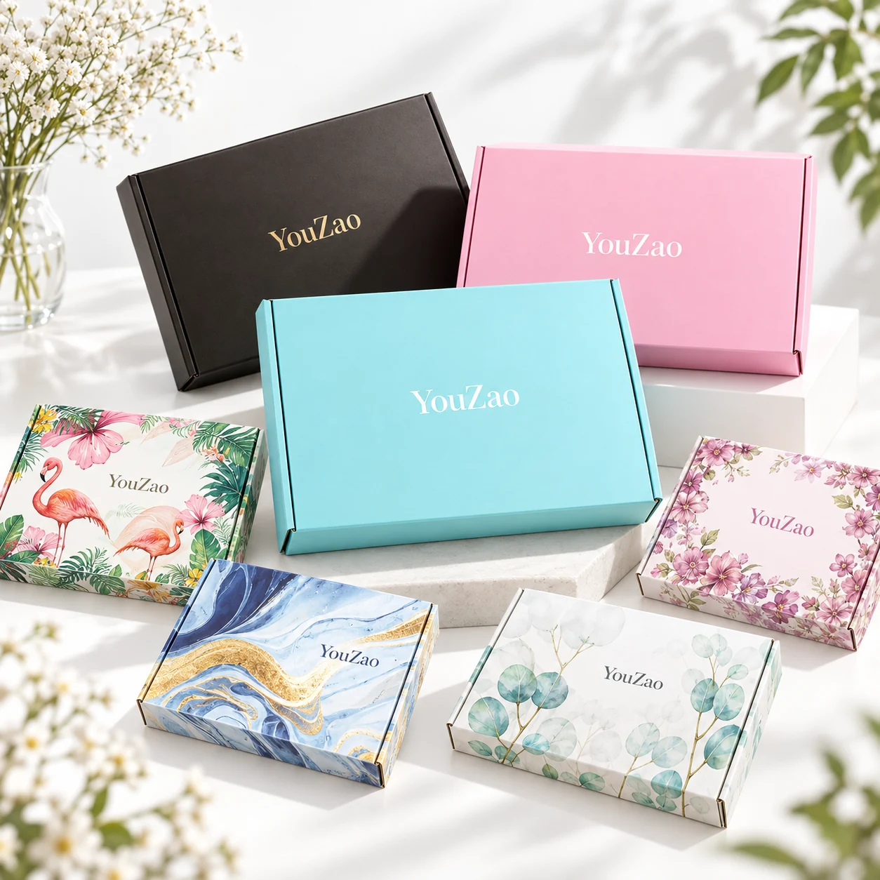 YouZao gift boxes with turquoise pink black floral and marble artwork