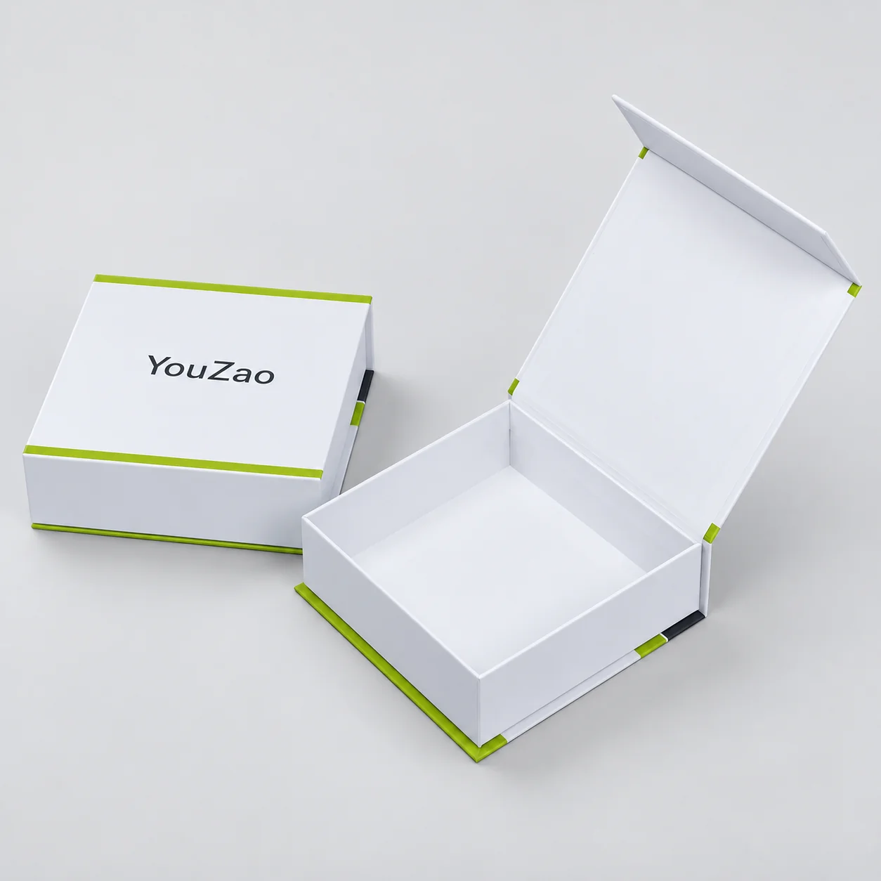 Open white hinged magnetic box without an insert beside a closed box